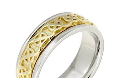 This amazing Celtic wedding ring features a highly polished Celtic spiral design, with high polish . The overall effect is striking and the endless spiral can symbolize the love between a couple. This beauty is crafted in 14k two tone gold