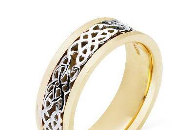 This amazing Celtic wedding ring features a highly polished Celtic spiral design, with high polish . The overall effect is striking and the endless spiral can symbolize the love between a couple. This beauty is crafted in 14k two tone gold