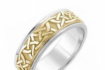 This fabulous Celtic wedding ring features a highly polished Celtic spiral design, with high polish . The overall effect is striking and the endless spiral can symbolize the love between a couple. This beauty is crafted in 14k two tone gold