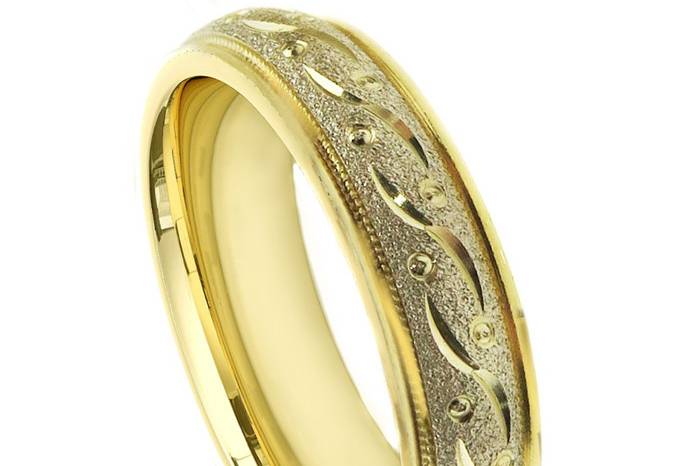 An amazingly crafted wedding band.  The Wedding Ring is comfort fitted so the ring feels more comfortable. Center is 14K yellow gold with shiny finish , twist milgrain with milgrains on each side and both sides of the ring is White gold with shiny finish.