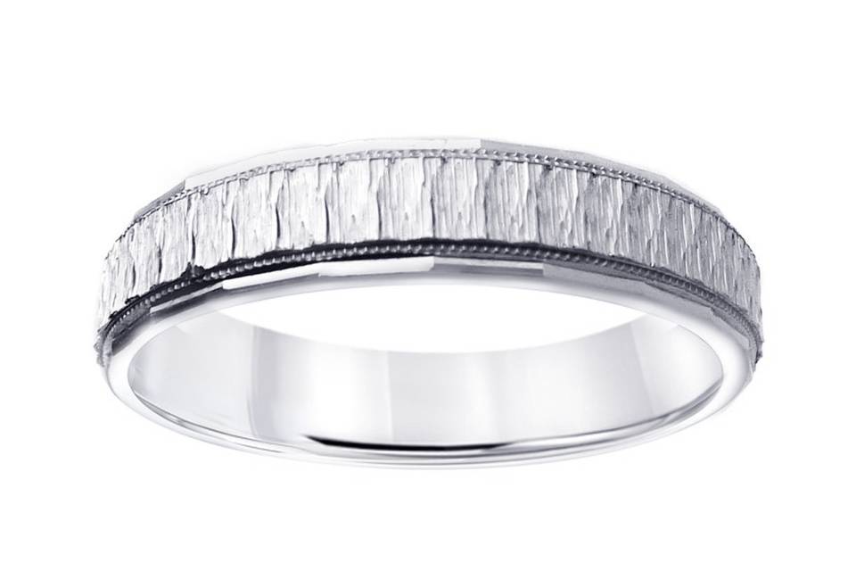 Contemporary Gents wedding ring crafted of 14k high polish white gold with four round cut diamonds set diagonally weighing a total of approximately 0.20 carats. Available in any size.