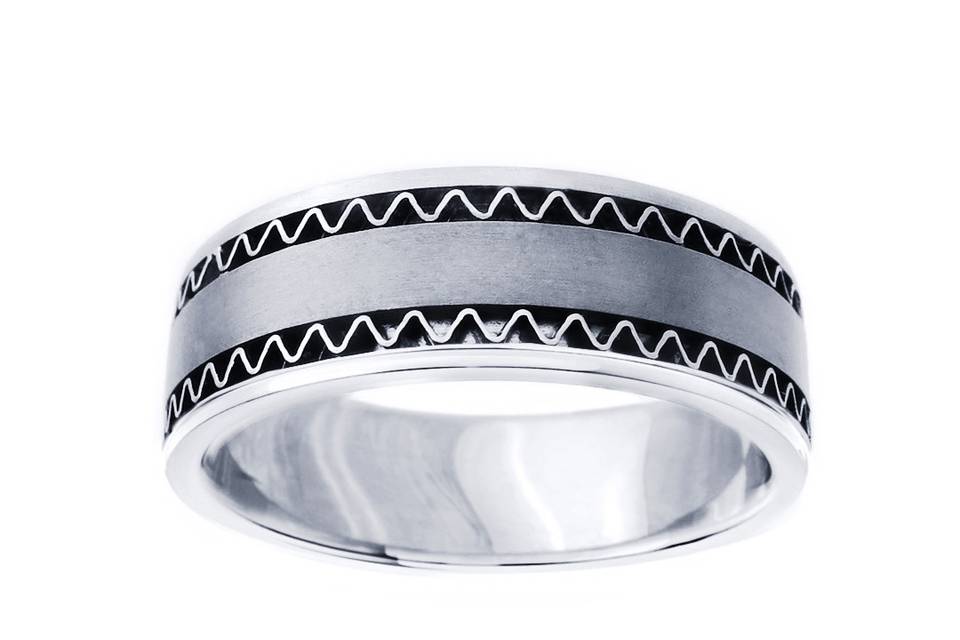 This 14k white gold and yellow gold wide hand crafted wedding band has a matte finish with two lines of cut work close to the edges which adds a simple yet classic look to this band. Available in any size or width.