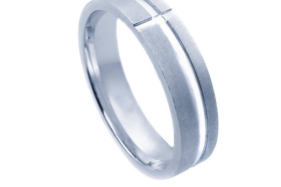 Contemporary white gold wedding band crafted in 14k white gold with satin finish and bright diagonal cuts forming a zig-zag design throughout the band. This unisex band is comfort fit and would be a pleasure for anyone to wear it on a daily basis. Available in any size and width.