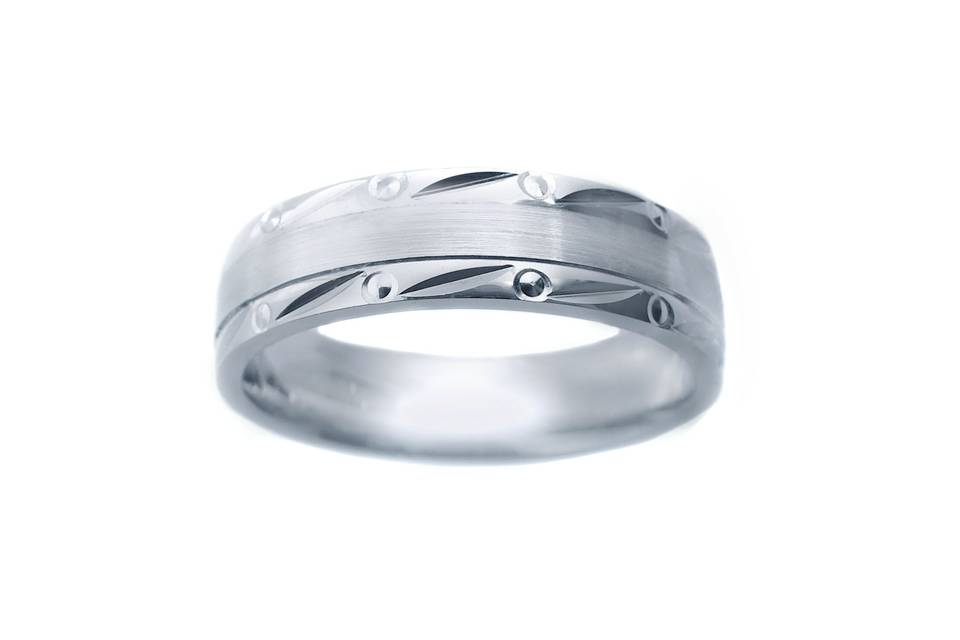 This 14k two tone wedding band has a unique look with fine etched lines cut all around the band with bright cut circles among them. Two high polish parallel cuts separate the center. This modern comfort fit, best seller has a very different look to it. available in any size and width.