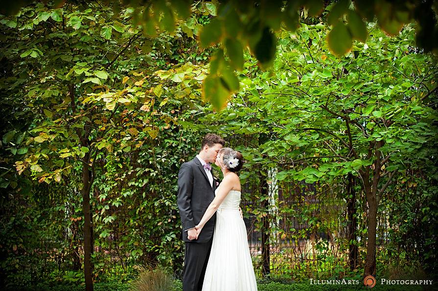 Couple kissing among trees