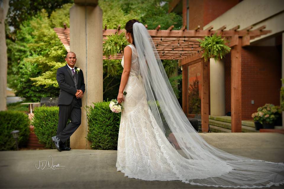 Groom admmiring his bride