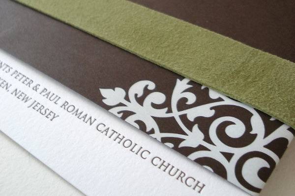 Chocolate and chartreuse letterpress invite wrapped in suede band