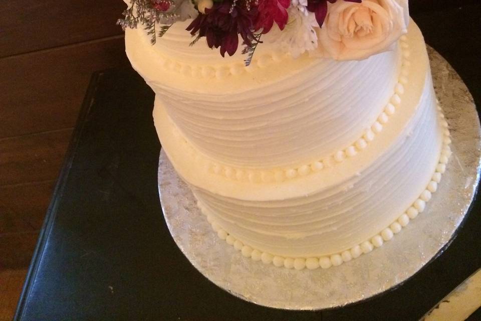 Cake with vibrant floral embellishments