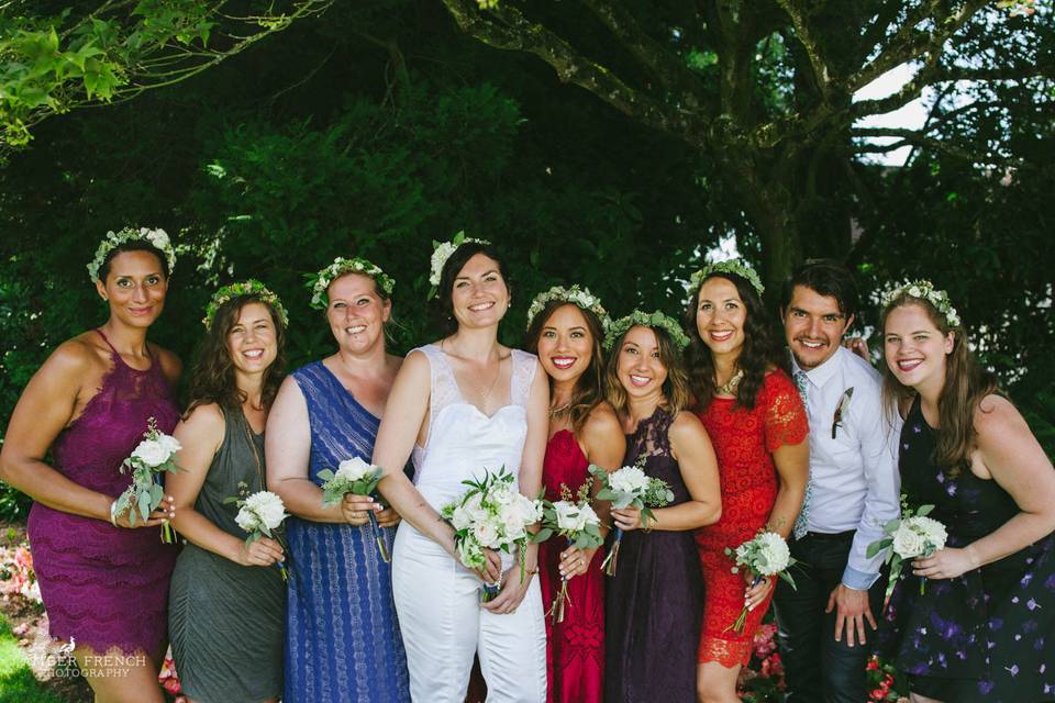 Bride with her crew of bridesmaids, with floral head bands and bouquets. Amber french photography.