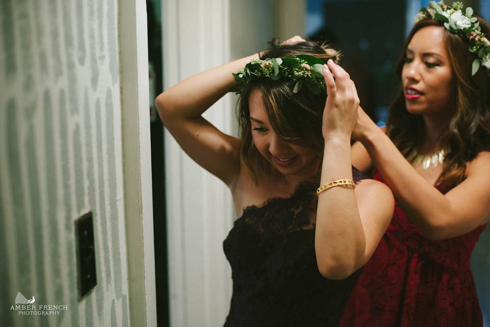 Bridesmaids helping putting on their floral headbands