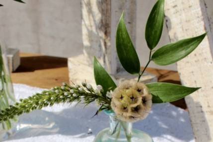 Sweet little mini arrangements for the bar, with scabiosa pods.