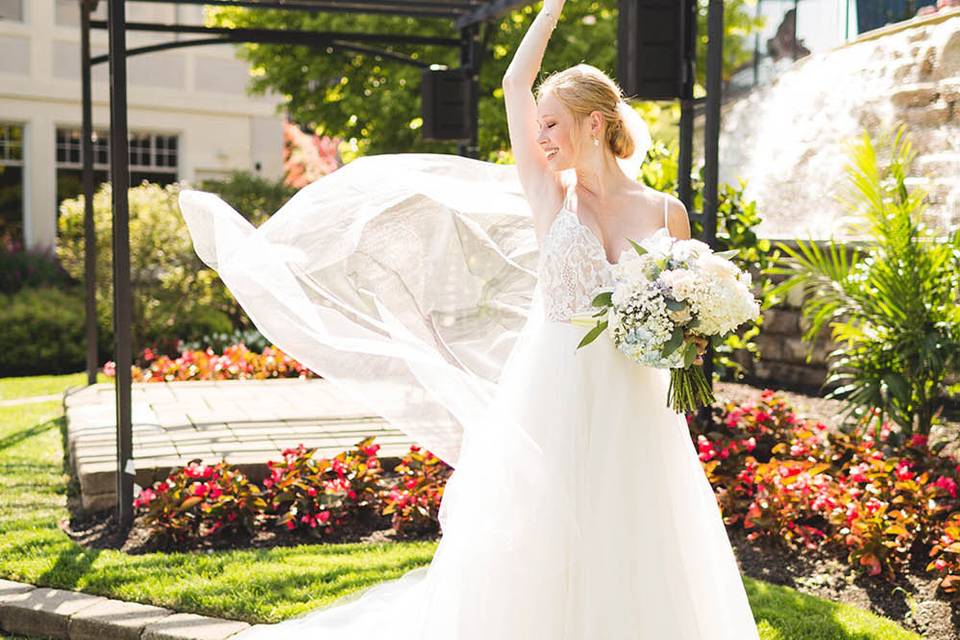 Bride twirling with veil