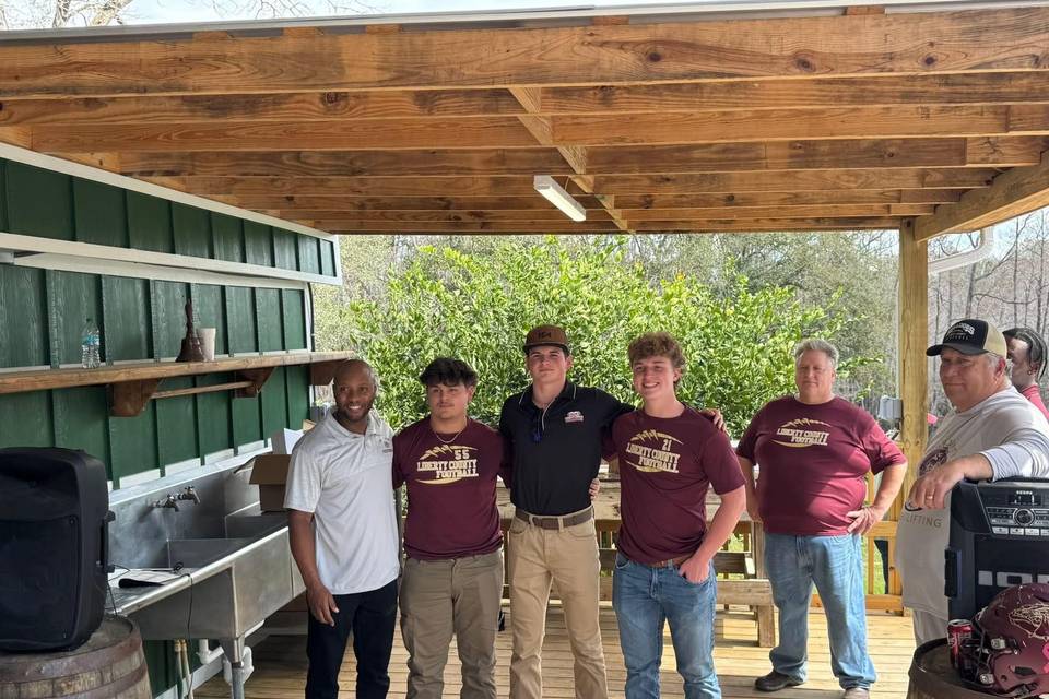 Football players with coach