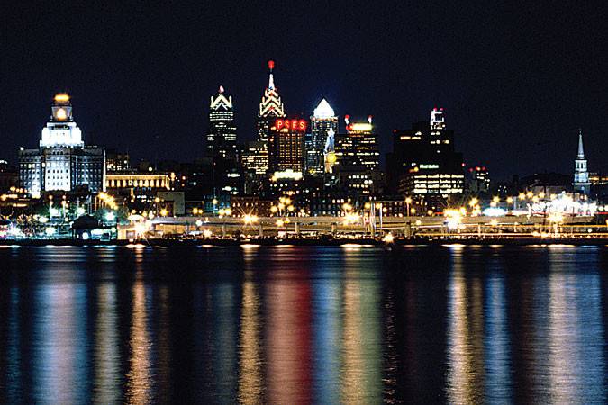 Philadelphia skyline reflecting off the Delaware River. Get this view first hand on board the Spirit and Freedom Elite.