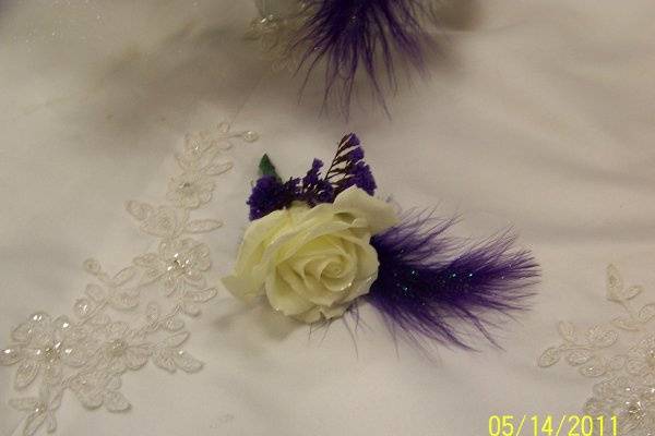 White rose with violet feather