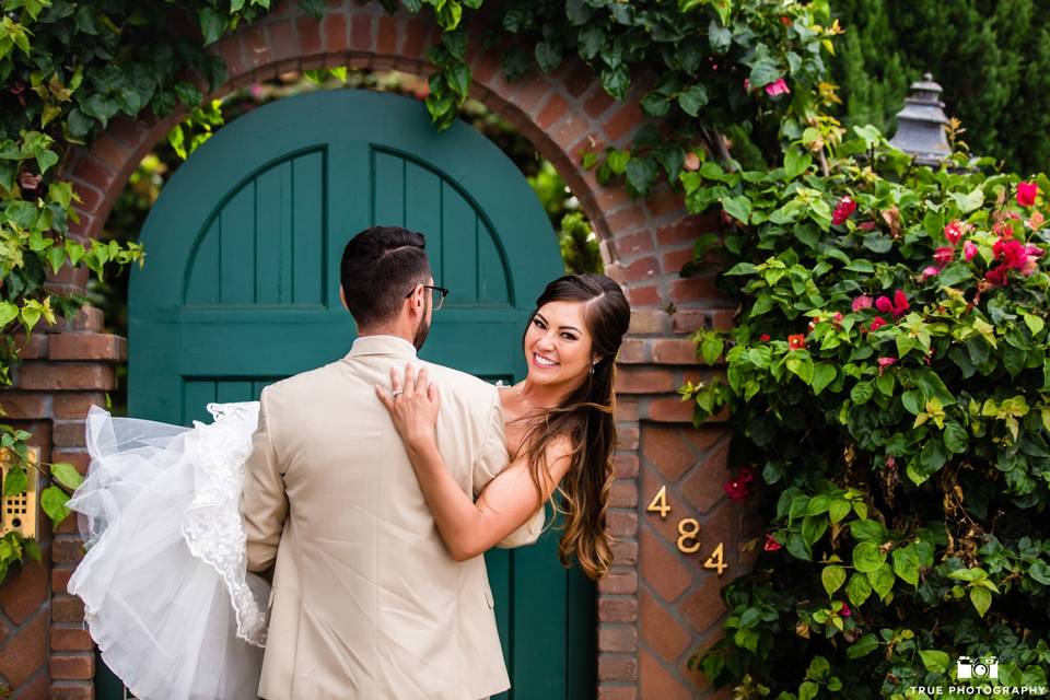 Groom carrying his bride