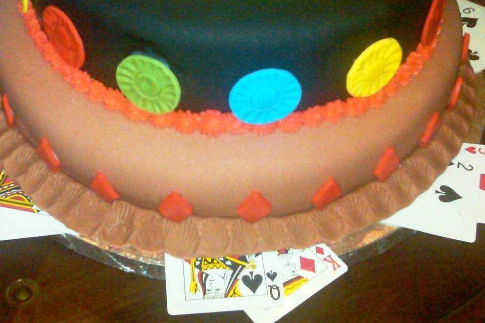 Perfect Groom's Cake! A great theme and delicious chocolate cake with a fondant wrap and edible chips! (Cake can be any flavor).