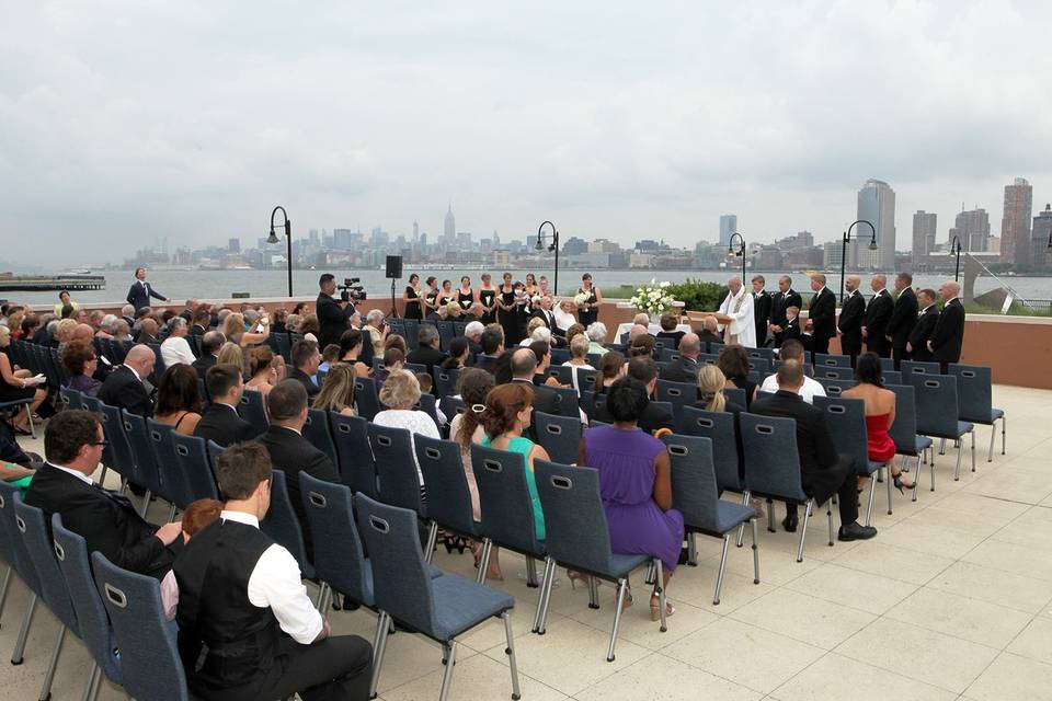 Outdoor wedding with cityscape