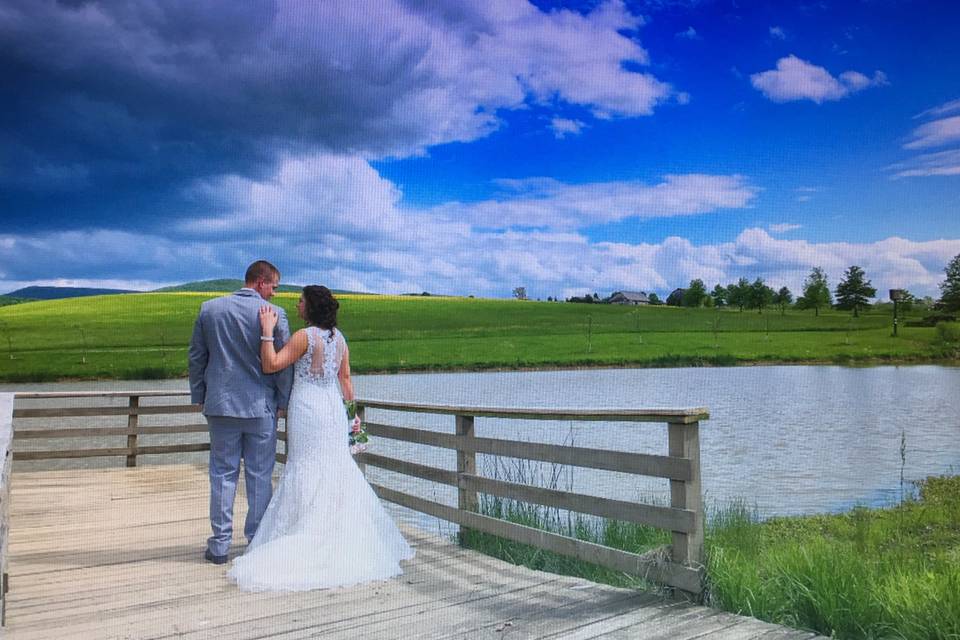 Blue sky by pond