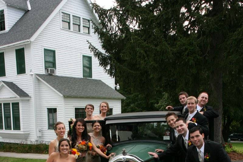 The couple with the bridesmaids and groomsmen