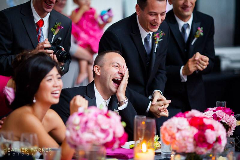 W Hotel wedding - groom filled with uncontrollable laughter as a video of him hula hooping is played during a toast.