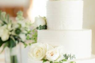 White wedding cake with white flowers