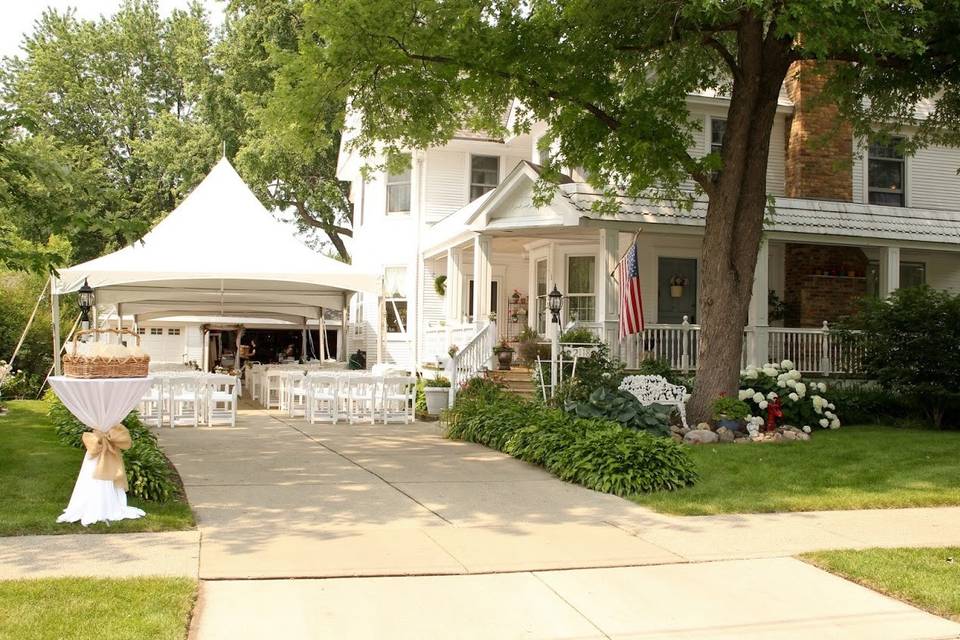 High-Peak Pole Tent, Cathedral Tent Walls, Ivory Kiting with String Lights, Chandeliers, Round Tables with Ivory Linens and Burlap Runners, Dance Floor