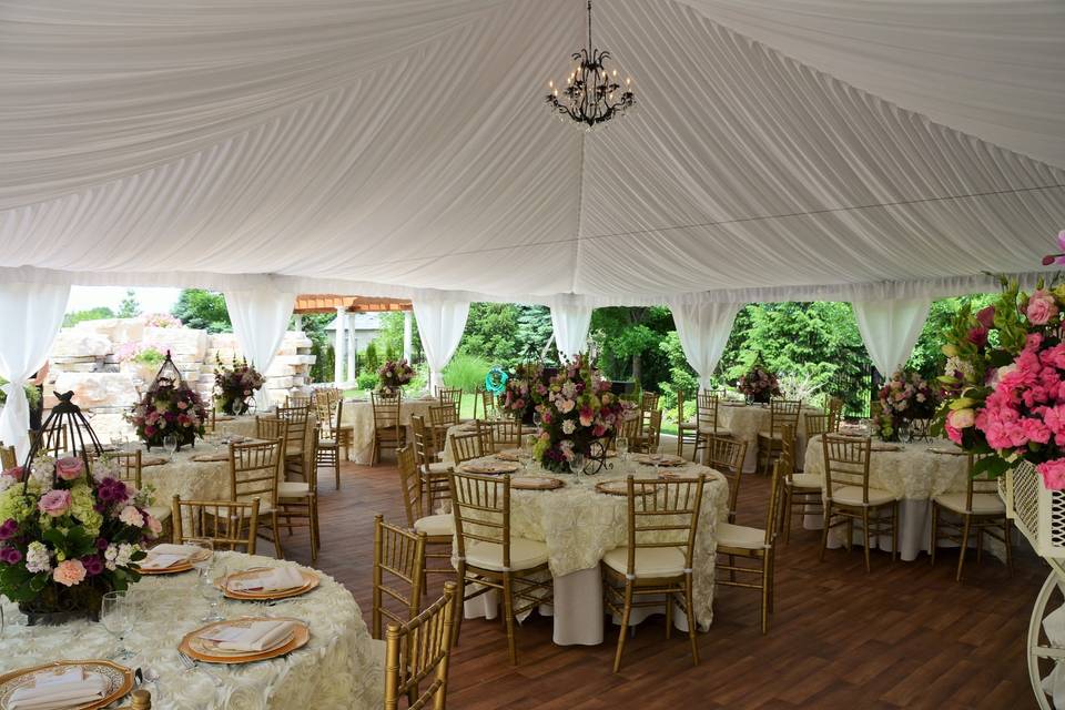 40'x40' High-Peak Fairy Tale Frame Tent with white full gathered tent liner, 15 light chandelier, white side pole swags with white ties, and full tent flooring