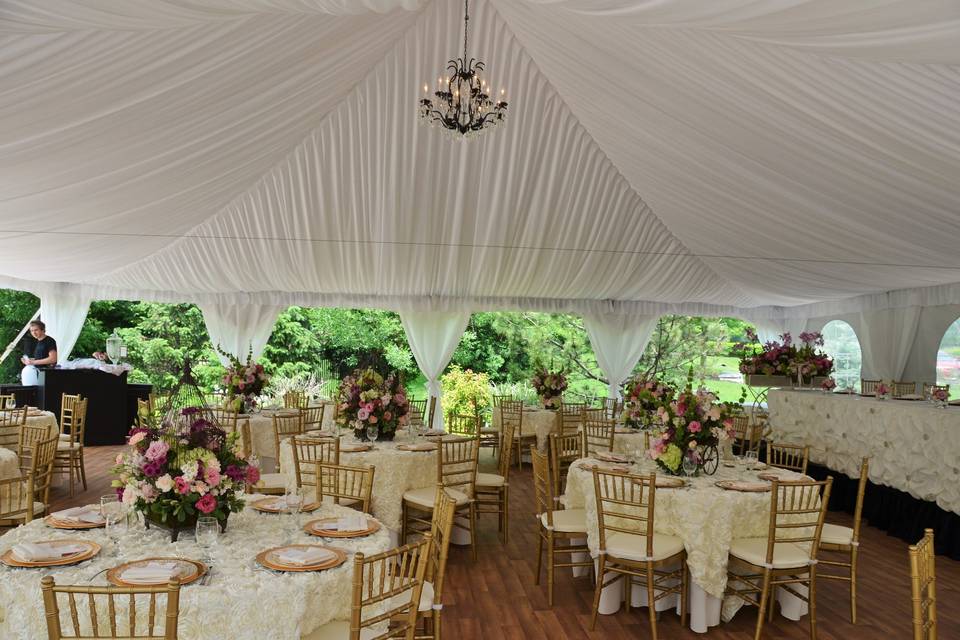 White side pole swags with white ties, and full tent flooring