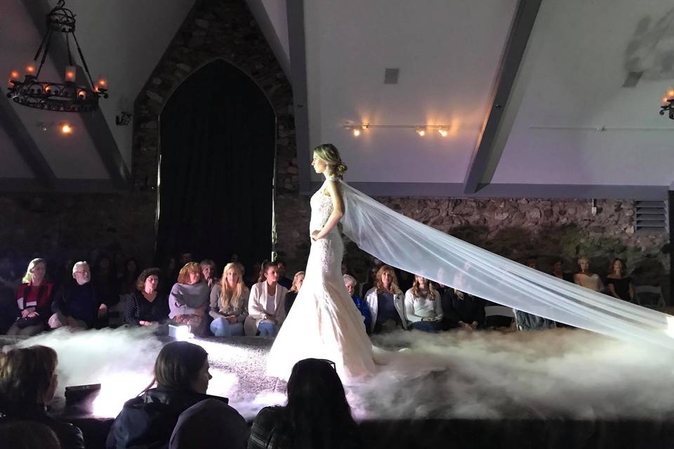 Dancing on a cloud on the runway at the Castle Farms wedding expo.