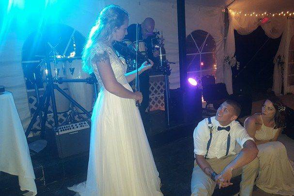 Some of our couples are also musicians. Here, the bride serenades her new husband on Thomas's violin.