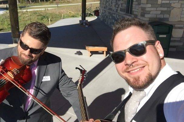 Thomas and Patrick playing live for the ceremony of the Bairds. The wedding was held at Dark Sky Park.