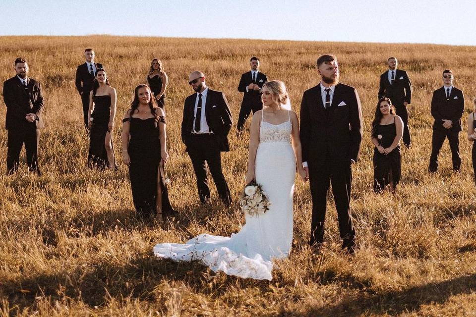 Bridal party in hay field
