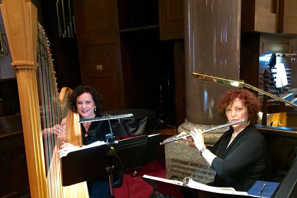 Laura byrne's flute & harp duo at a church wedding ceremony.