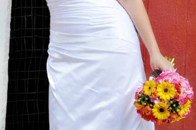 Bridal Bouquet with pink hydrangea, yellow gerbera daisies, orange tulips, and green hypericum berry.