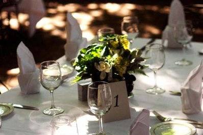 Centerpiece with vase lined in red cabbage leaves. Kale, stock, cymbidums orchids.