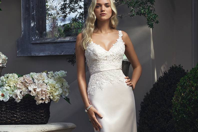 Style 2210 <br> Sheath silhouette gown with non-beaded lace appliqués on tulle that embellish the bodice and the skirt.  Tank straps have an organic lace edge.  Small of waist is accented with a petite band.
