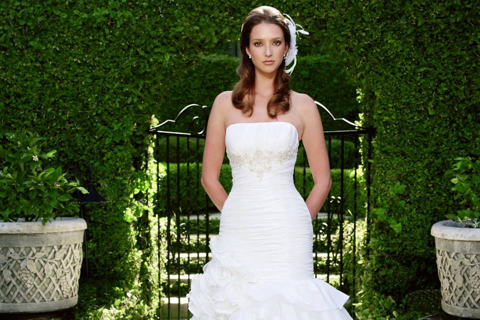 Style 2024 <br> Sweetheart neckline beaded and embroidered netting over Silky Satin and the bodice is accented with a Duchess Silk sash  with beaded buttons on the back of the bodice.