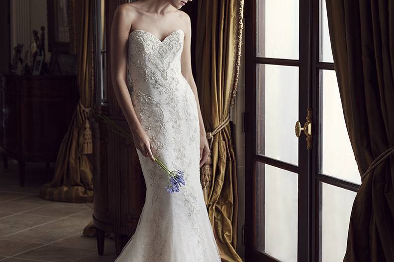 Casablanca Bridal Style 2231 - Carnation <br> Carnation is a strapless, form fitting, fit-n-flare gown that boasts a sumptuous combination of beaded and embroidered tulle over iridescent organza with sleek satin lining. The sweetheart neckline and sweeping train add a dramatic twist to this gown.