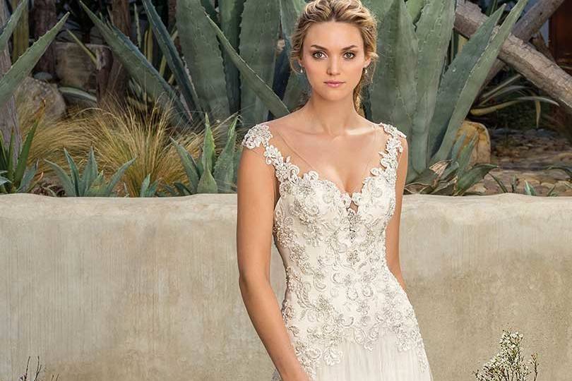 Style 2305 Madrona		Sheath tulle gown with beaded lace appliques dropped waist, V-neckline, illusion back and semi-cathedral length train.