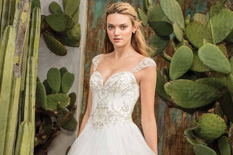 Style 2308 Paloma		 Ruffled ballgown with beaded sweetheart neckline bodice, basque waist, illusion back and cap sleeves.
