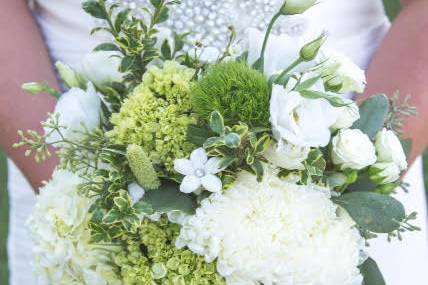 Organic handtied bouquet of hydrangea, lisianthus, stephanotis, roses and mums.