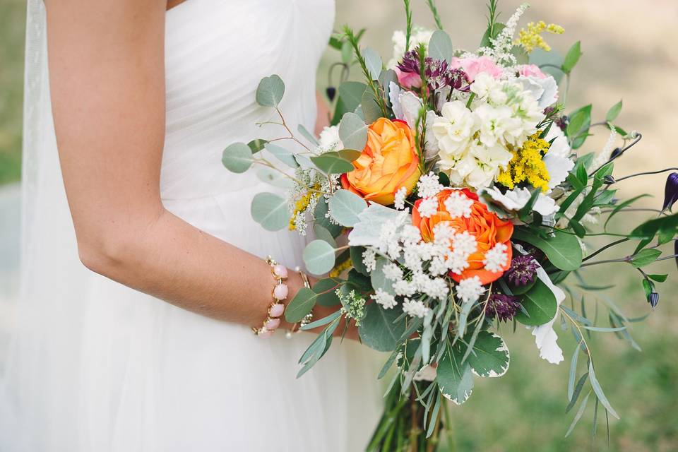 Eucalyptus, Queen Anne's Lace, Roses, clematis, stock, veronica and astrantia all combined for a great fresh picked garden look.