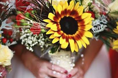 Rich colors of fall.  Sunflowers, roses, wheat and berries!