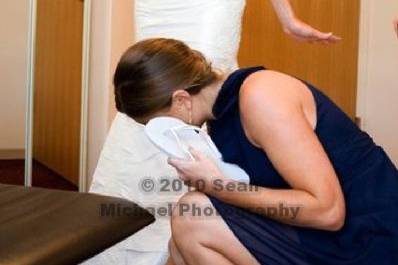 The bride slipping on shoes