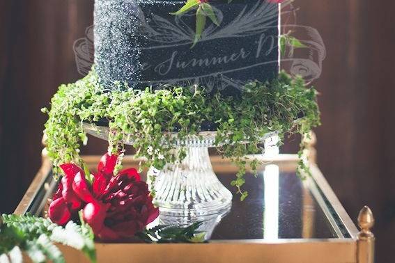 White wedding cake with figurines on top