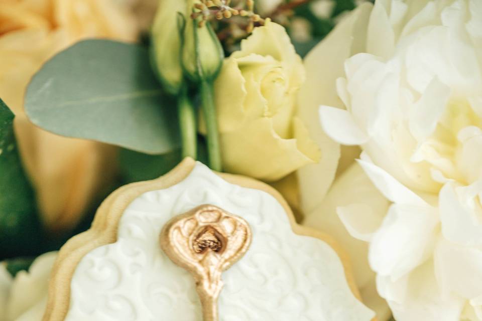 White wedding cake with red roses