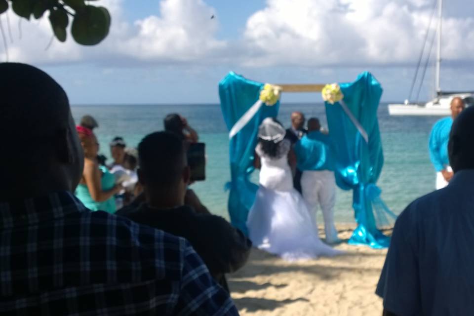 On Lindbergh Bay Beach in St. Thomas, U.S.V.I done by Laurens Bridal of the Virgin Islands, located in Tortola, British Virgin Islands.  We took the ferry over to do this wedding!  Its about 30-45 minutes boat ride!