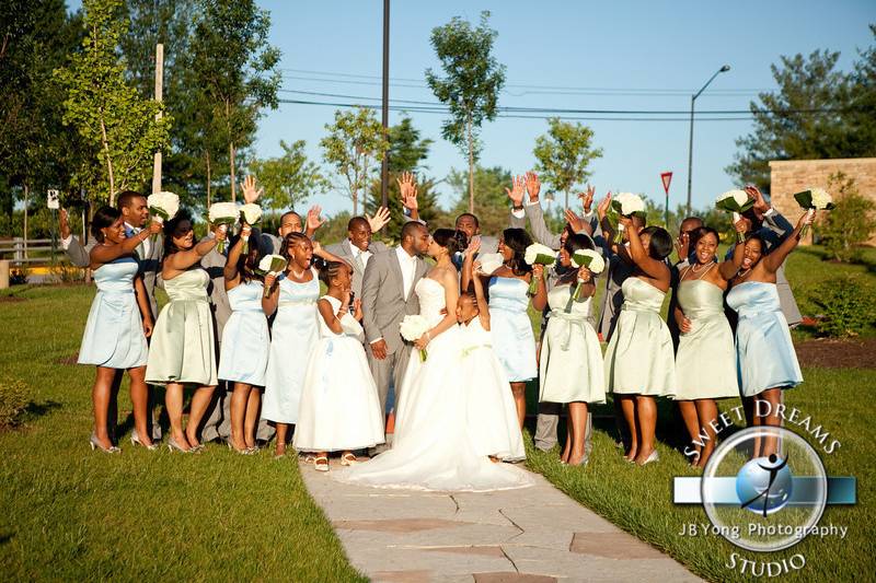 The couple with the bridesmaids and groomsmen