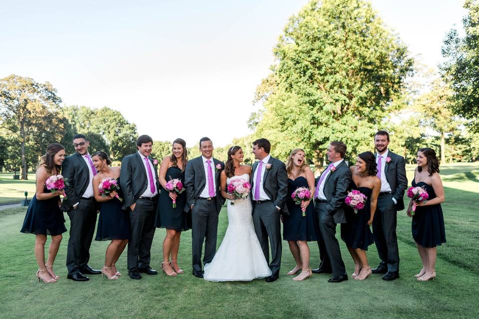 The couple with the bridesmaids and groomsmen